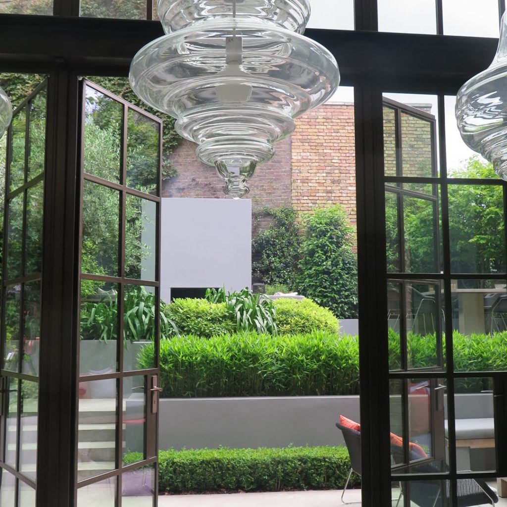 #courtyard #london #viewthroughthewindow #crittall #fireplace #polishedconcrete ...