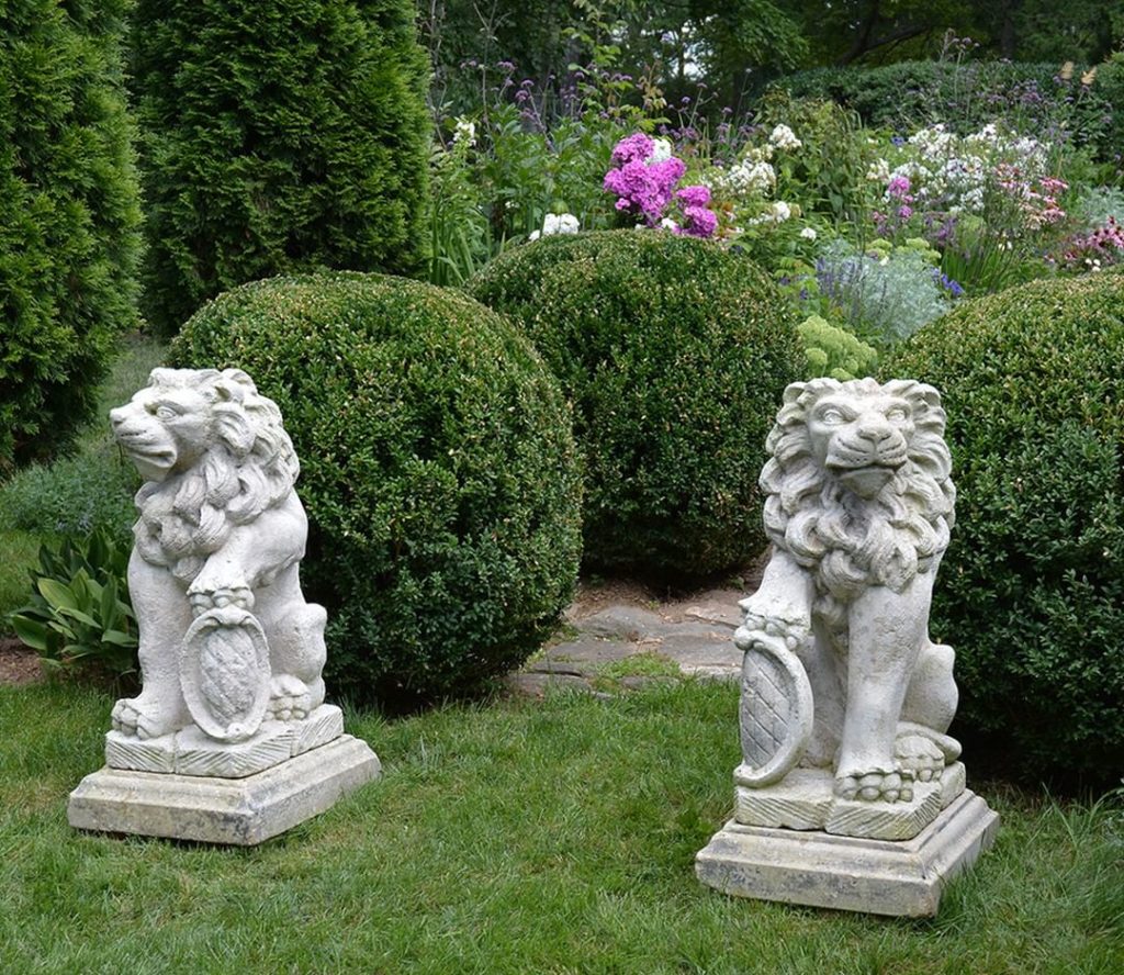 Keeping guard over the garden.
.
This pair of carved stone gate pier seated lion...