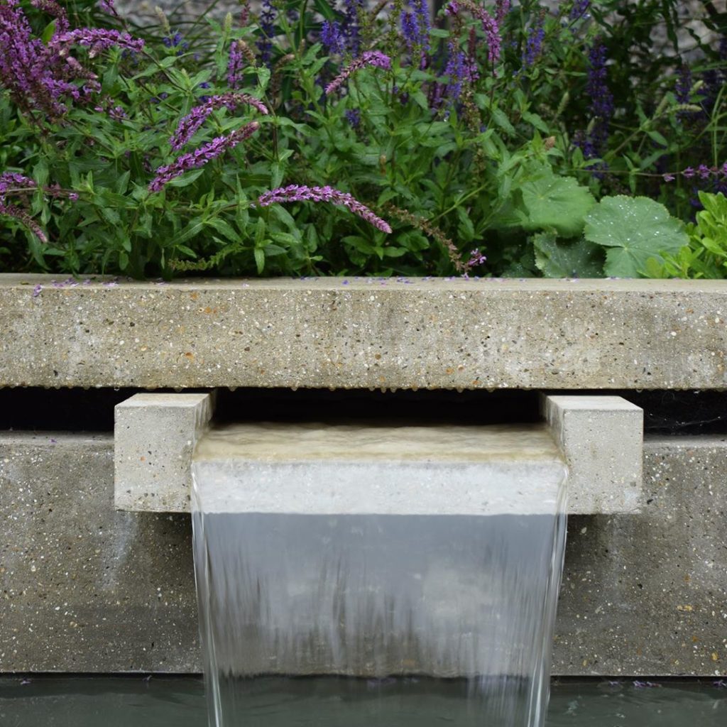 #waterchute #polishedconcrete #landscapedesign #water #charlotterowegardendesign...
