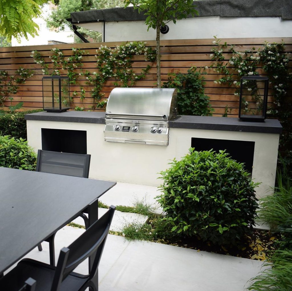 New #garden with built-in #bbq #summernights #outdoorkitchen #gardendesign #town...