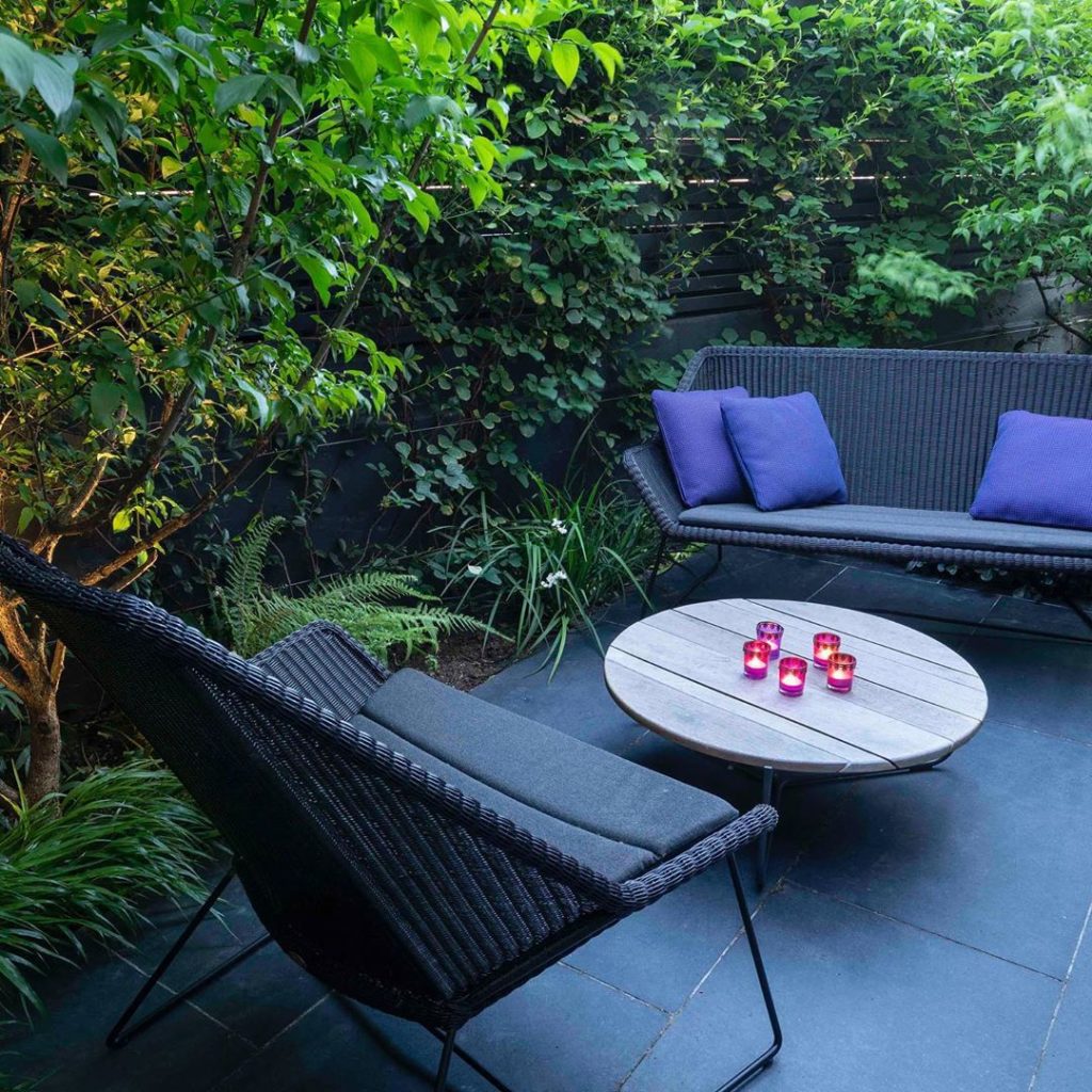 Our tiny triangular #garden in Dalston. Dark #paving deep grey #outdoor #furnitu...