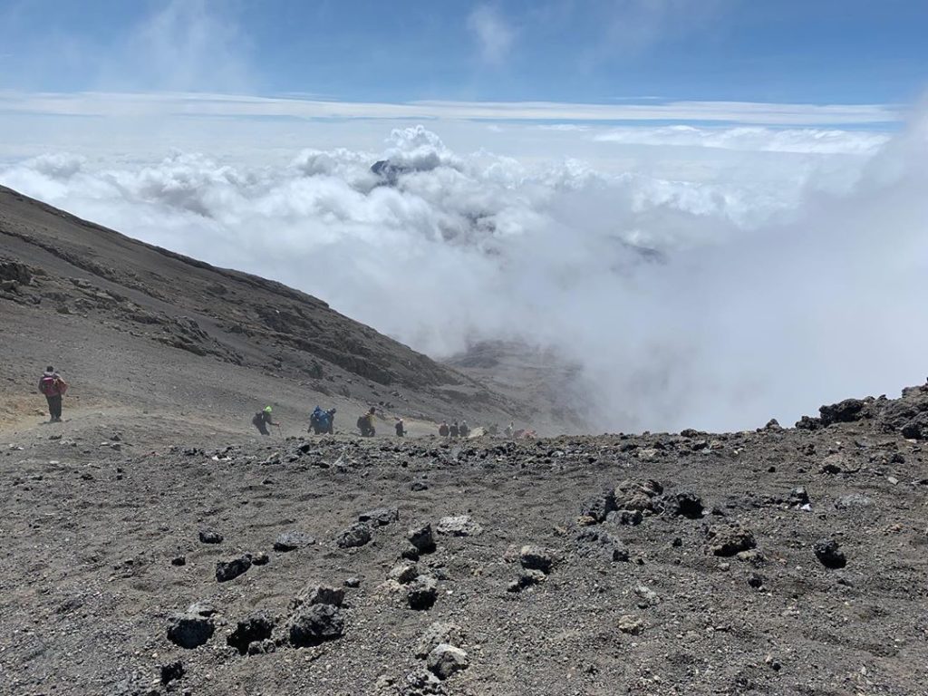 Making our descent down through the clouds from Uhuru Peak - literally on top of...