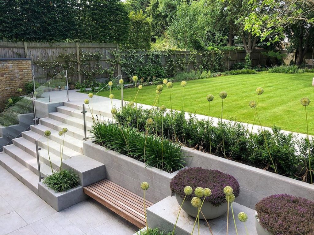 jamesleelandscapedesign: We designed a series of stepped planters that use vibrant planting to soften the… We designed a series of stepped planters that use vibrant planting to soften the...