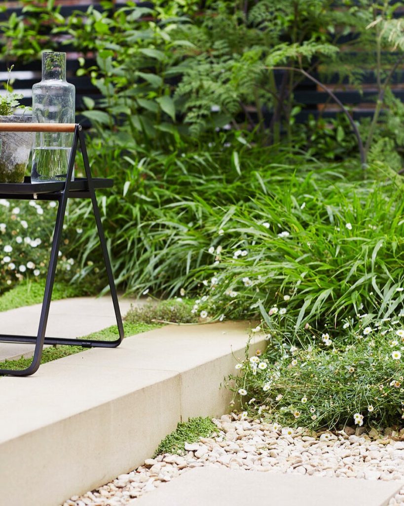 Details make the difference A solid York stone step and lush planting combine on...