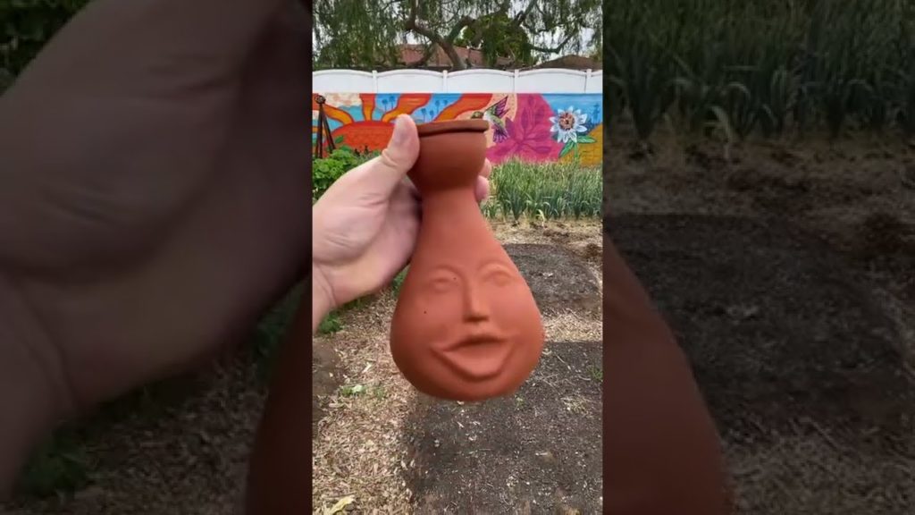 Burying a clay face in my garden