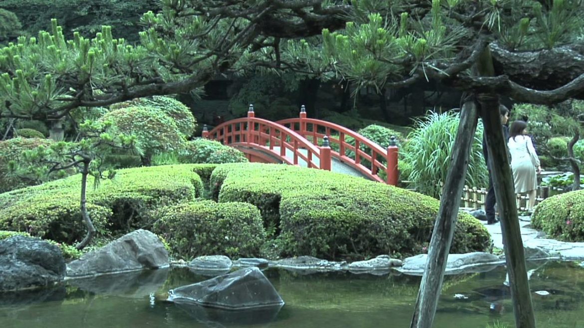 Japanese Garden in Tokyo, Japan with waterfalls, bridge, miniature landscapes and bonsai trees Japanese Garden in Tokyo, Japan with waterfalls, bridge, miniature landscapes and bonsai trees