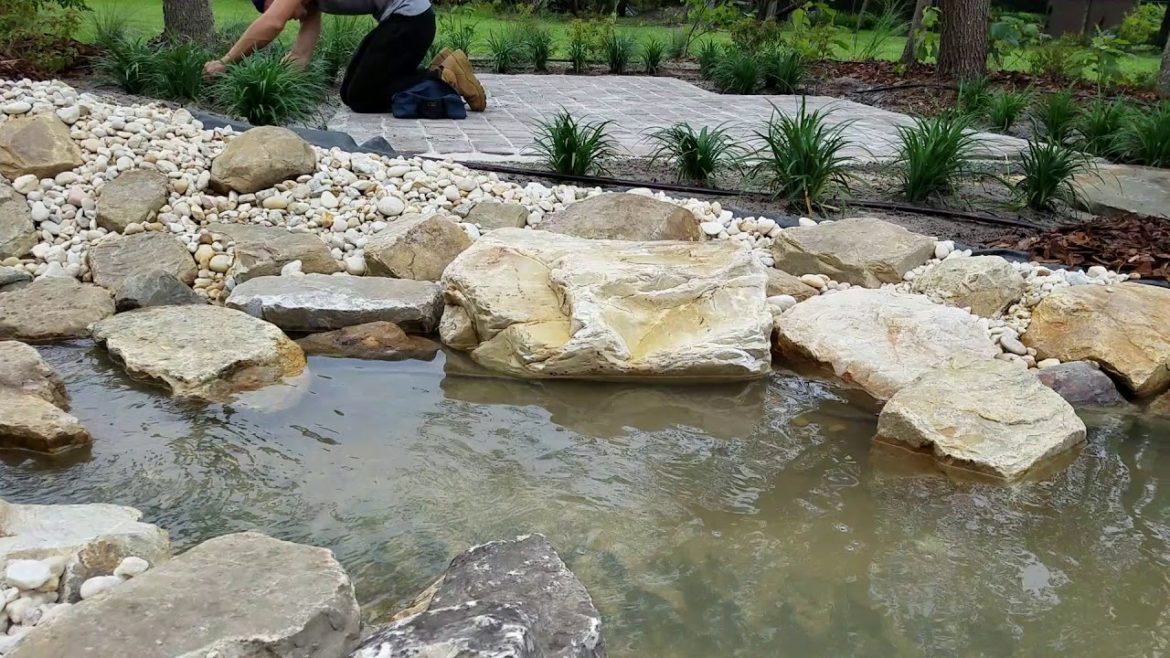 river bed flowing water backyard landscape design orlando fl earthwise