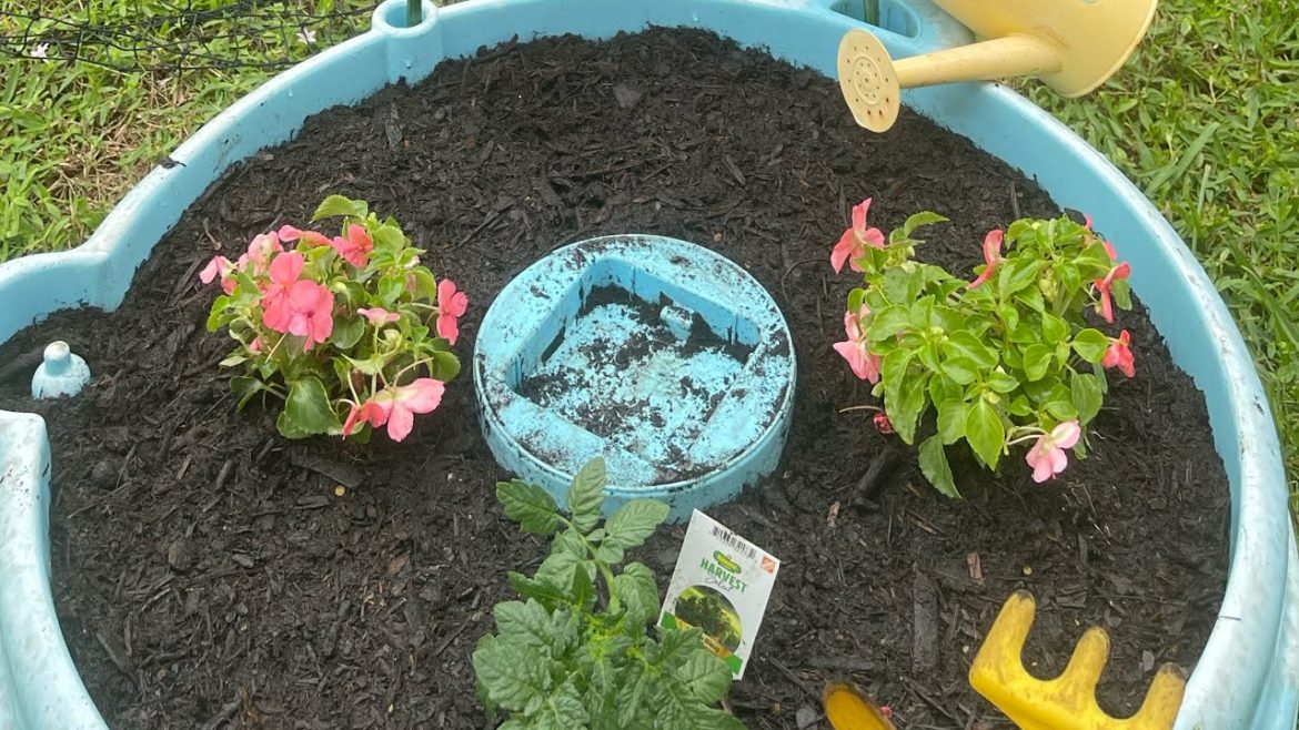 We repurpose a water play table into a raised garden bed!