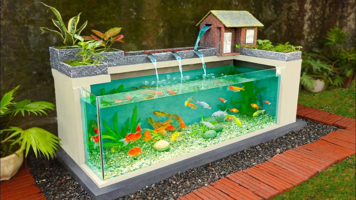 My Dad builds amazing waterfall aquarium for our empty garden My Dad builds amazing waterfall aquarium for our empty garden