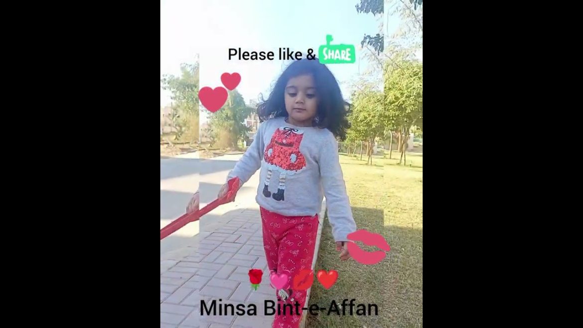 Minsa running beside garden