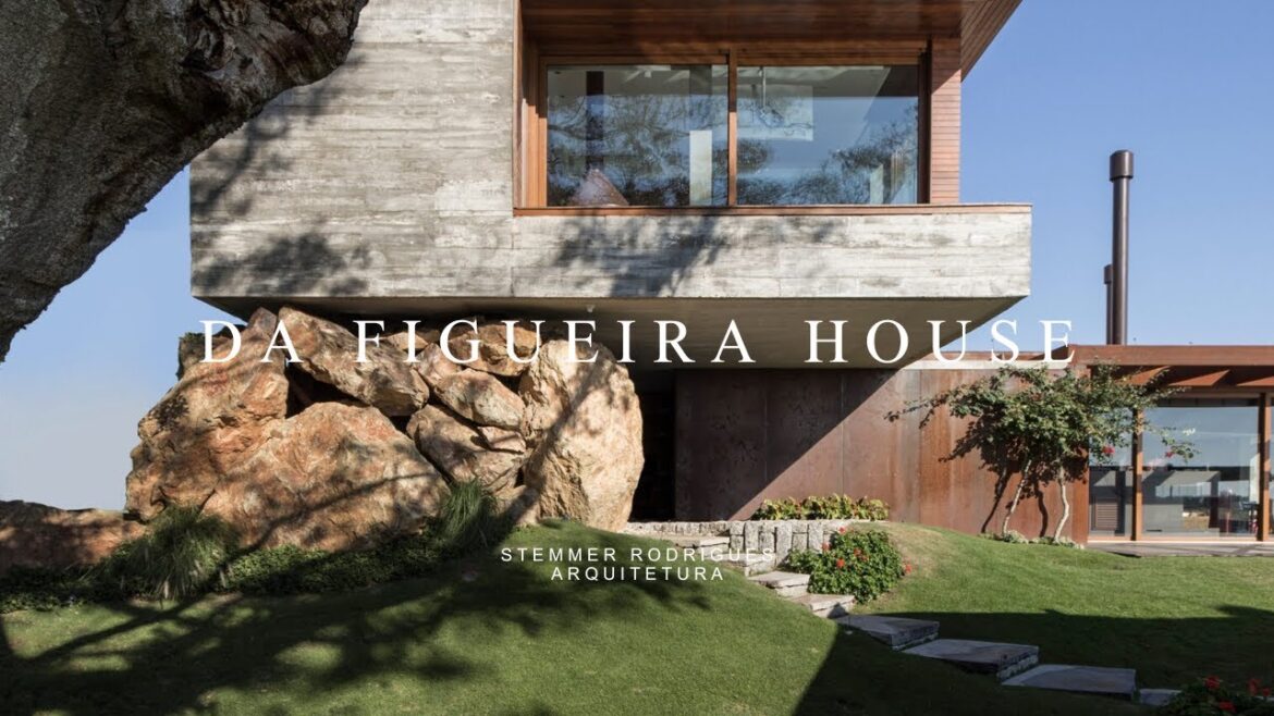 Modern Concrete House Design Nestled Across The Lake Supported By Natural Large Stones