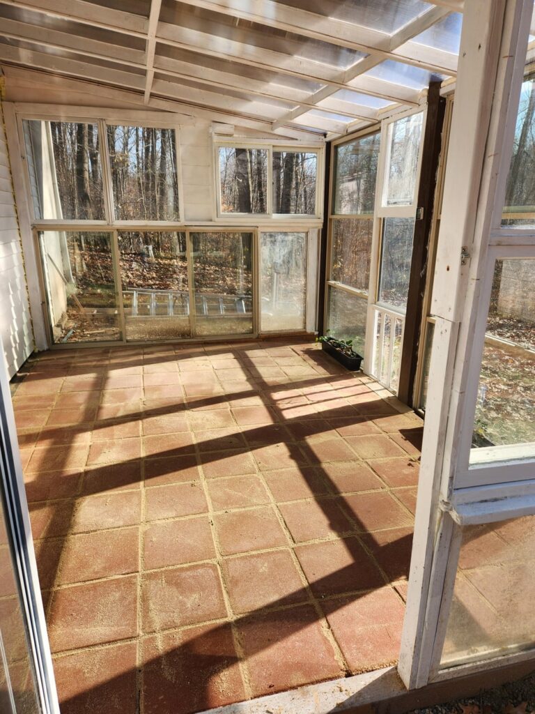 Our under deck greenhouse built from free windows, and other materials.