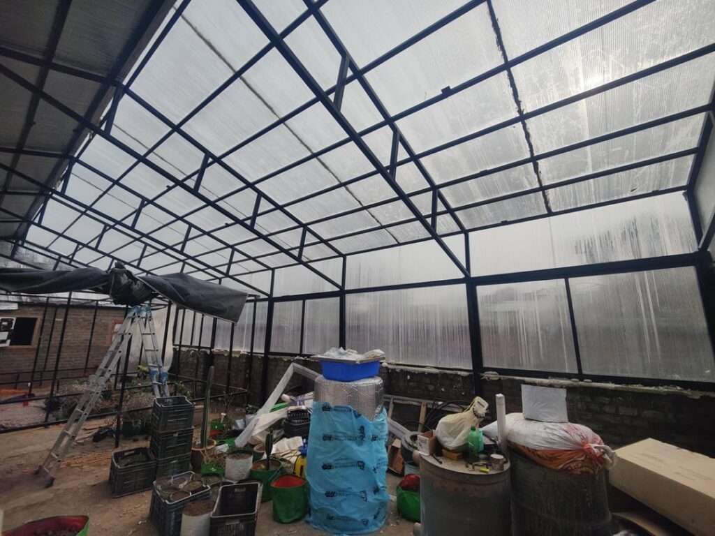 Excuse the mess, I finally build a 4 season greenhouse. How do I reduce the humidity if electricity is an issue ? Also what other things would you advise I add for the winter ahead to keep it warm, I am in a 7a zone.