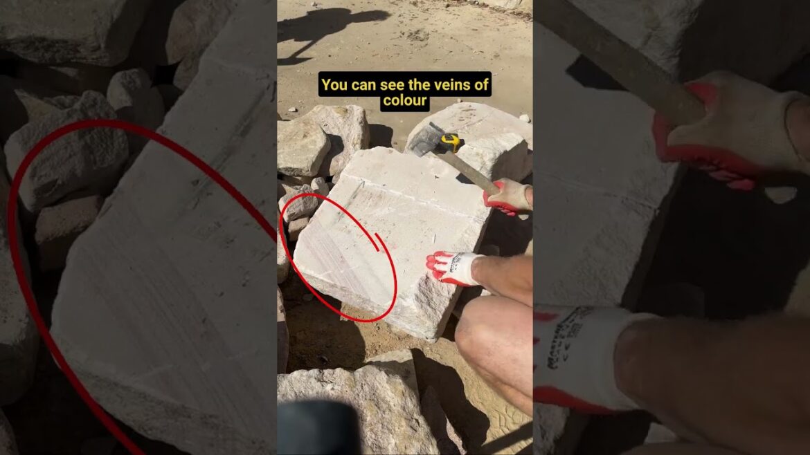 Hand shaping sandstone slab  #stonewalling #canberra #gardendesign