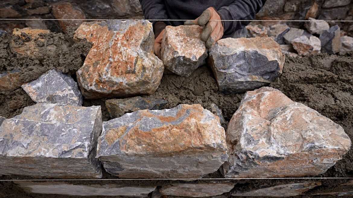 Building a Stone Wall with Concrete Building a Stone Wall with Concrete