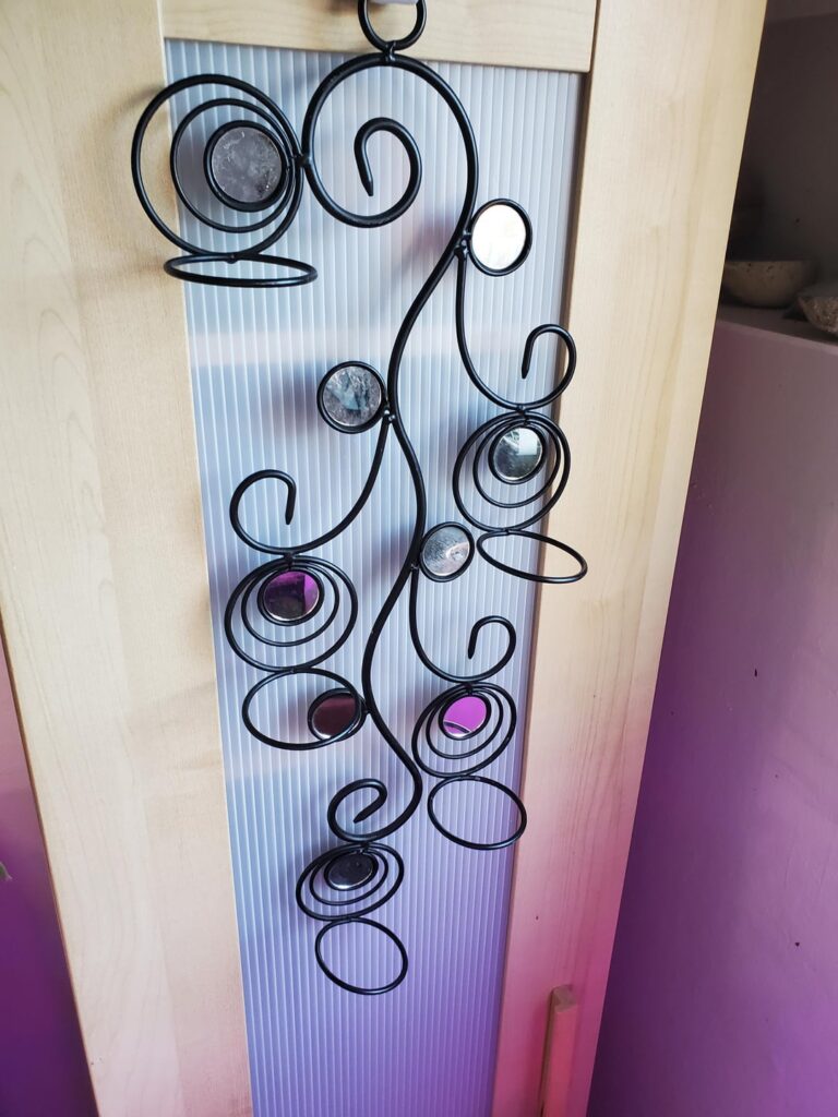 Friend gave this to me to use as an air plant holder. Ideas on something I can attach to the circles to keep air plants from falling through (besides buying bigger air plants 😅, though that is a real possibility)?