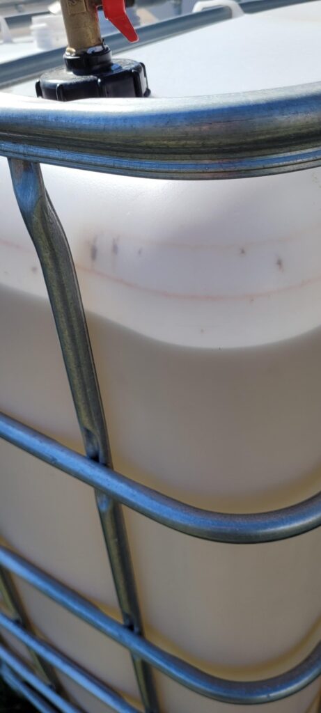 Rain barrel turned a reddish color. Rain barrel turned a reddish color.