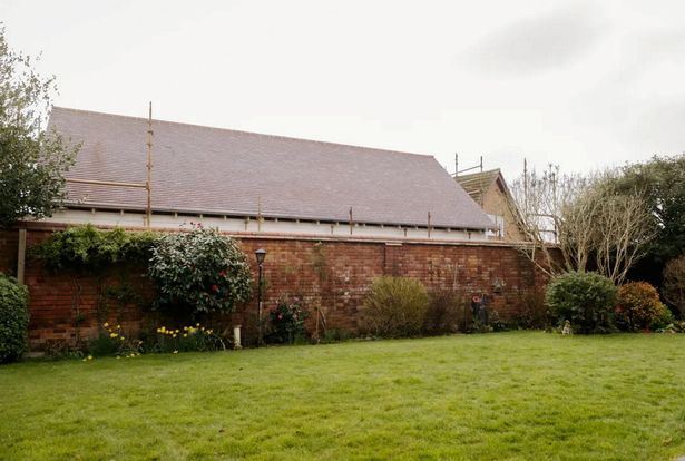 He returned from a month in India to find a large extension in a neighbouring garden