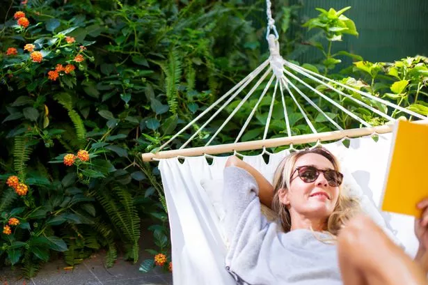 woman in garden relaxing 