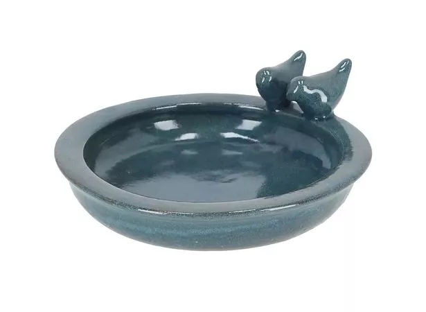 Photo shows petrol-coloured bird bath with two ceramic birds on the edge