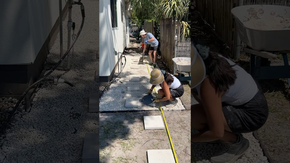 laying pavers for our rock path on our side yard