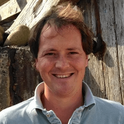 Headshot of a man smiling.