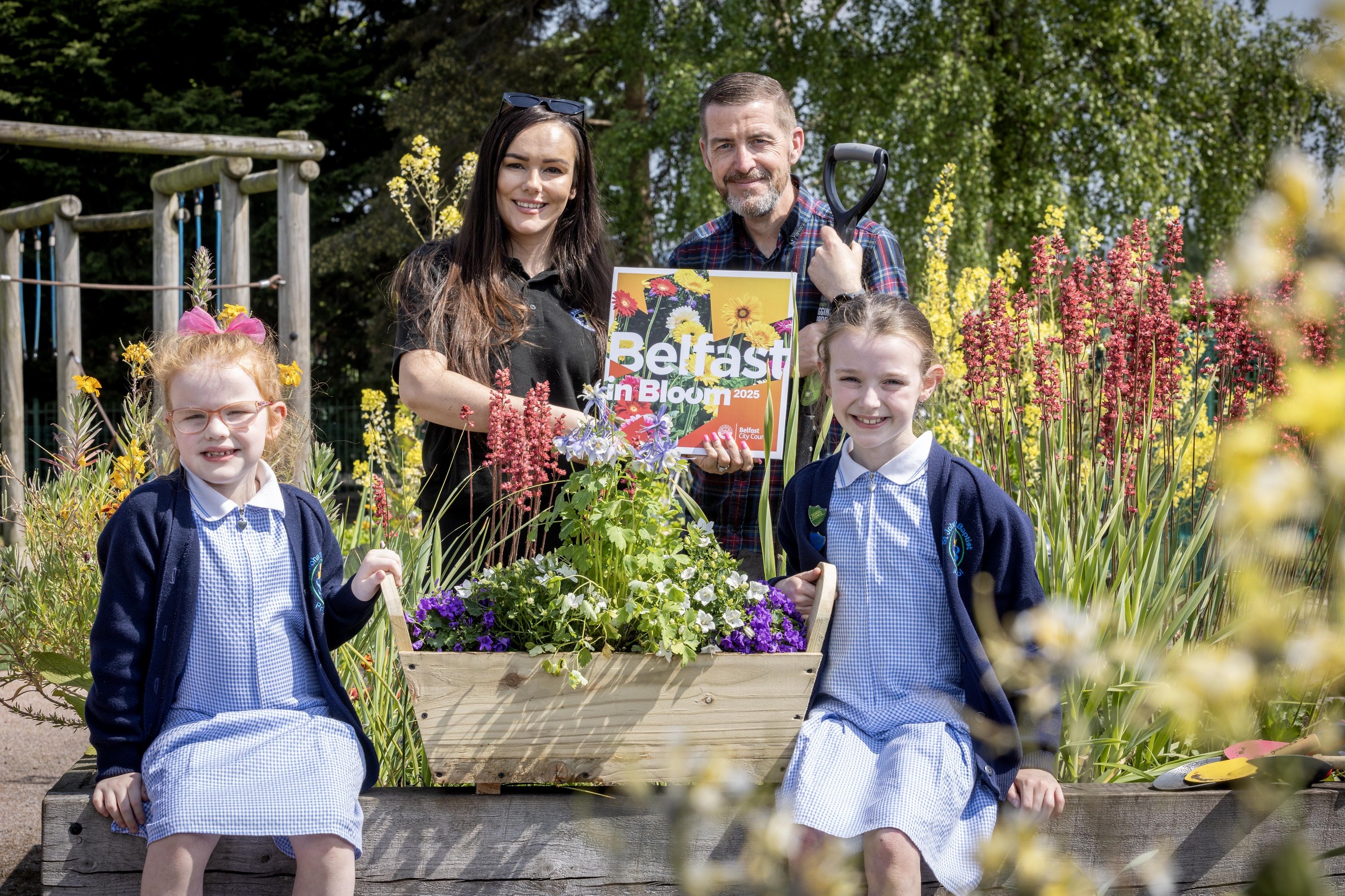 Juliette Ferris, Emma Ferris and Bella Ferris join Councillor Matt Garrett, Deputy Chair of Belfast City Council’s People and Communities Committee
