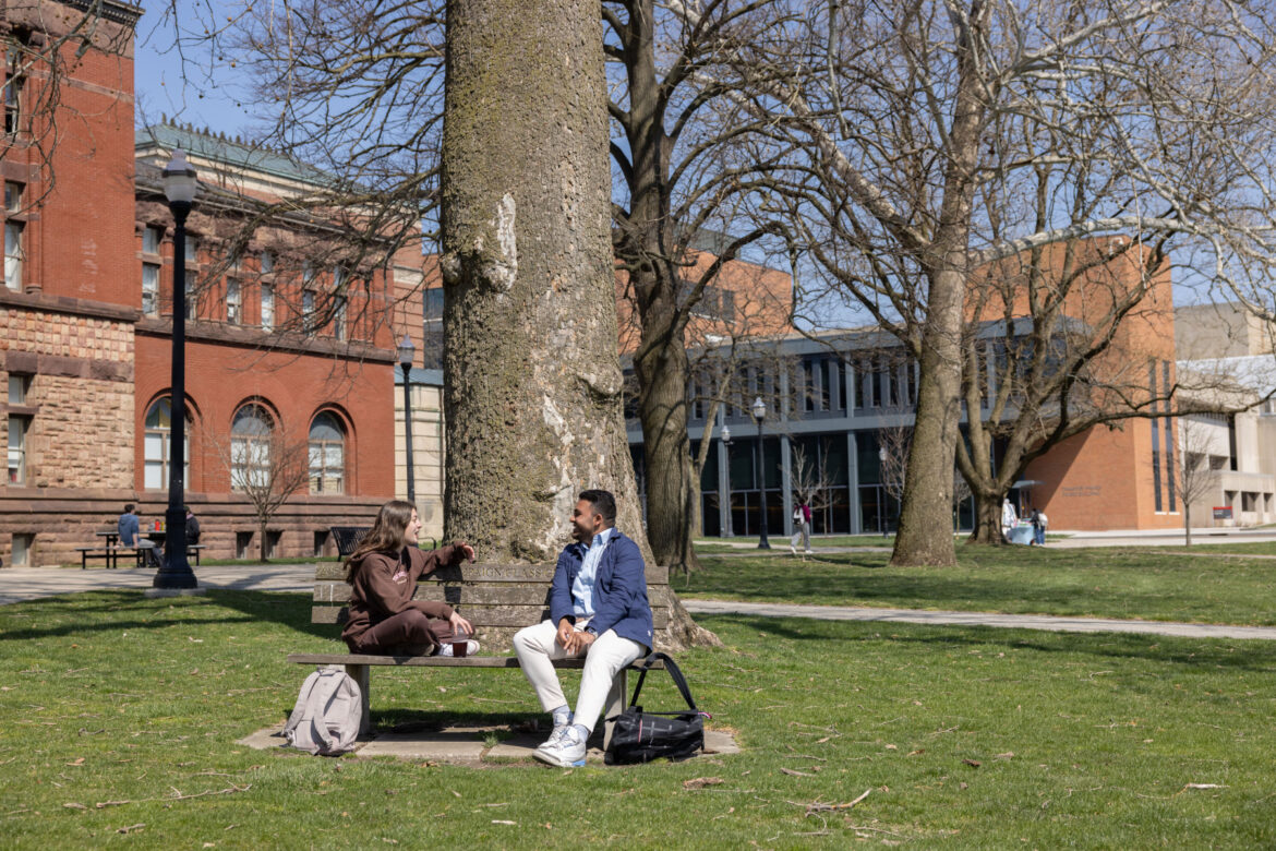 University landscape architect excited to activate Oval Two students sit on a bench on the Oval. More furniture options are coming soon.