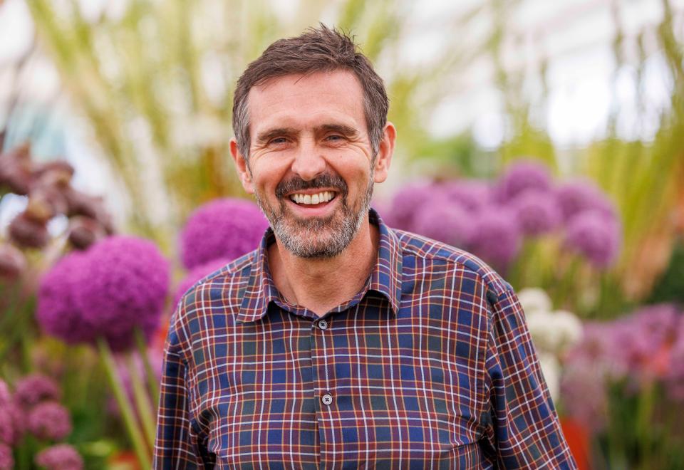 Adam Frost, television presenter and garden expert, smiling.