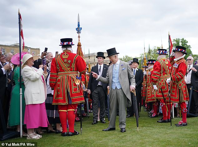Charles was dapper in his suit and waistcoat, teamed with a top hat, for today's garden party event
