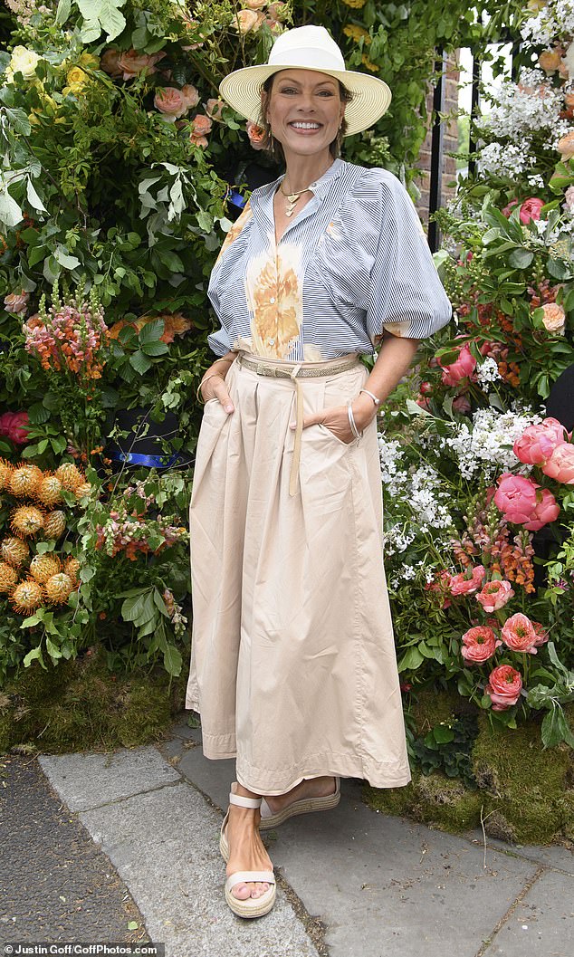 Former BBC broadcaster Kate Silverton, 54, looked elegant in a long cream skirt and oversized blue and white striped bell sleeve blouse