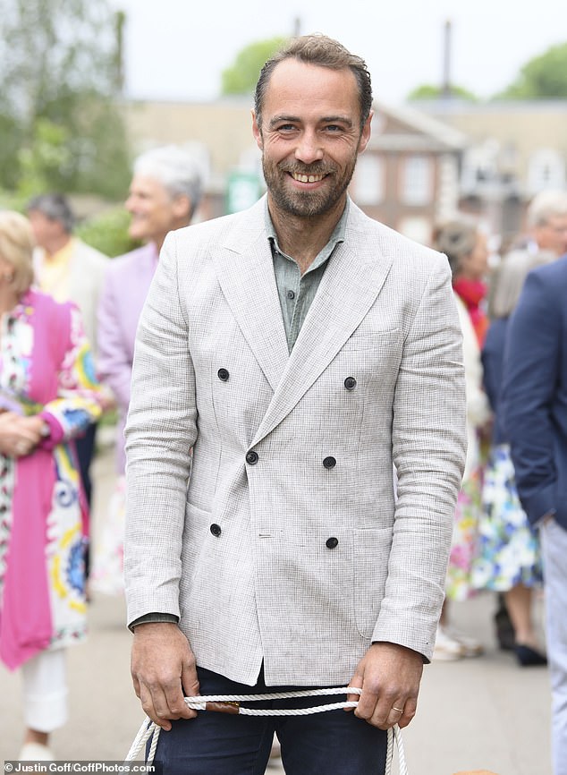 James, 38, looked smart in a cream blazer and navy chinos which he paired with a khaki shirt and brown shoes