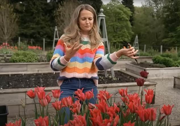 Kim shows off some of the flowers in the grounds of Cromlix