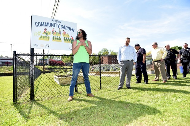 Joseph Stuppino, of the Garden Goombas, speaks in front of the Pittston Community Garden Monday, May 12, 2025. (SEAN MCKEAG / STAFF PHOTOGRAPHER)