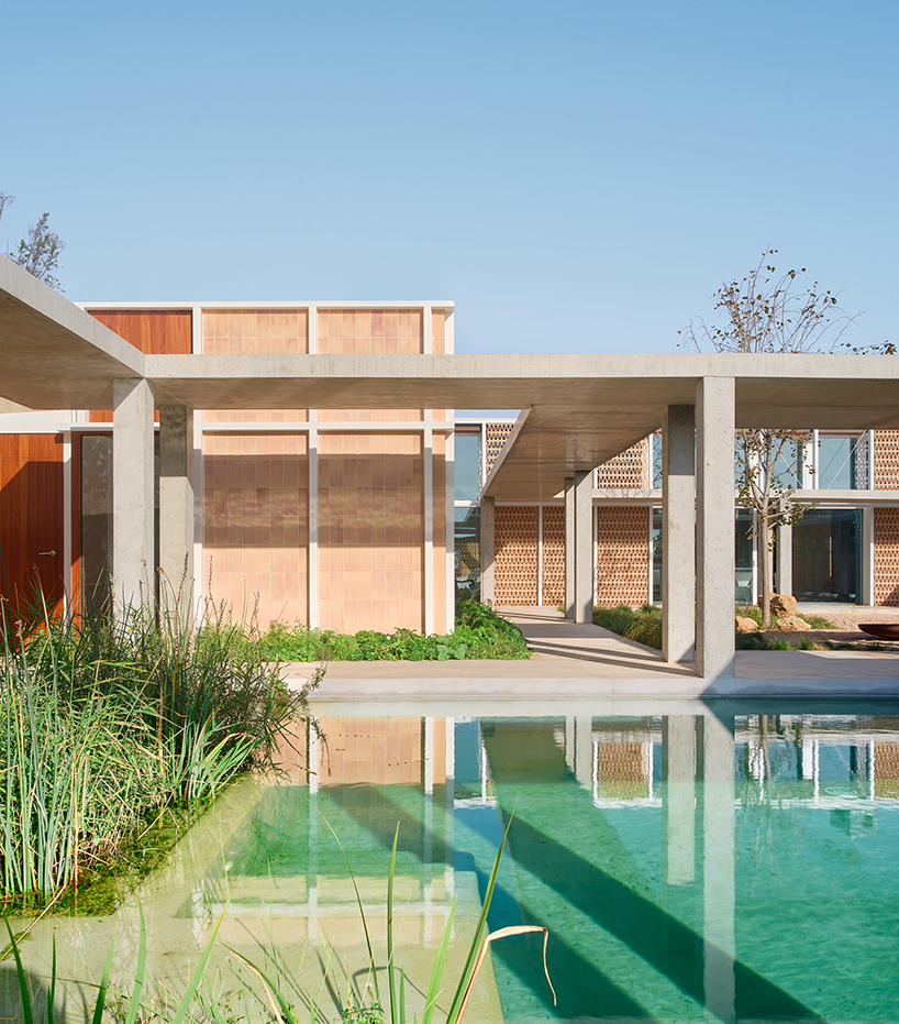 da.ch. crafts layered stone-paved landscape for casa tres patis in catalunya
