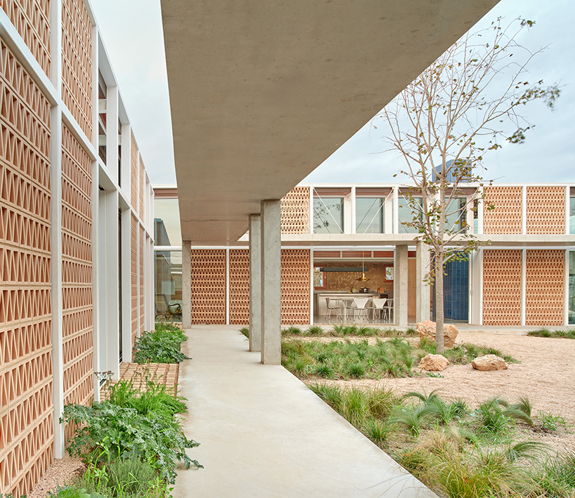 da.ch. crafts layered stone-paved landscape for casa tres patis in catalunya