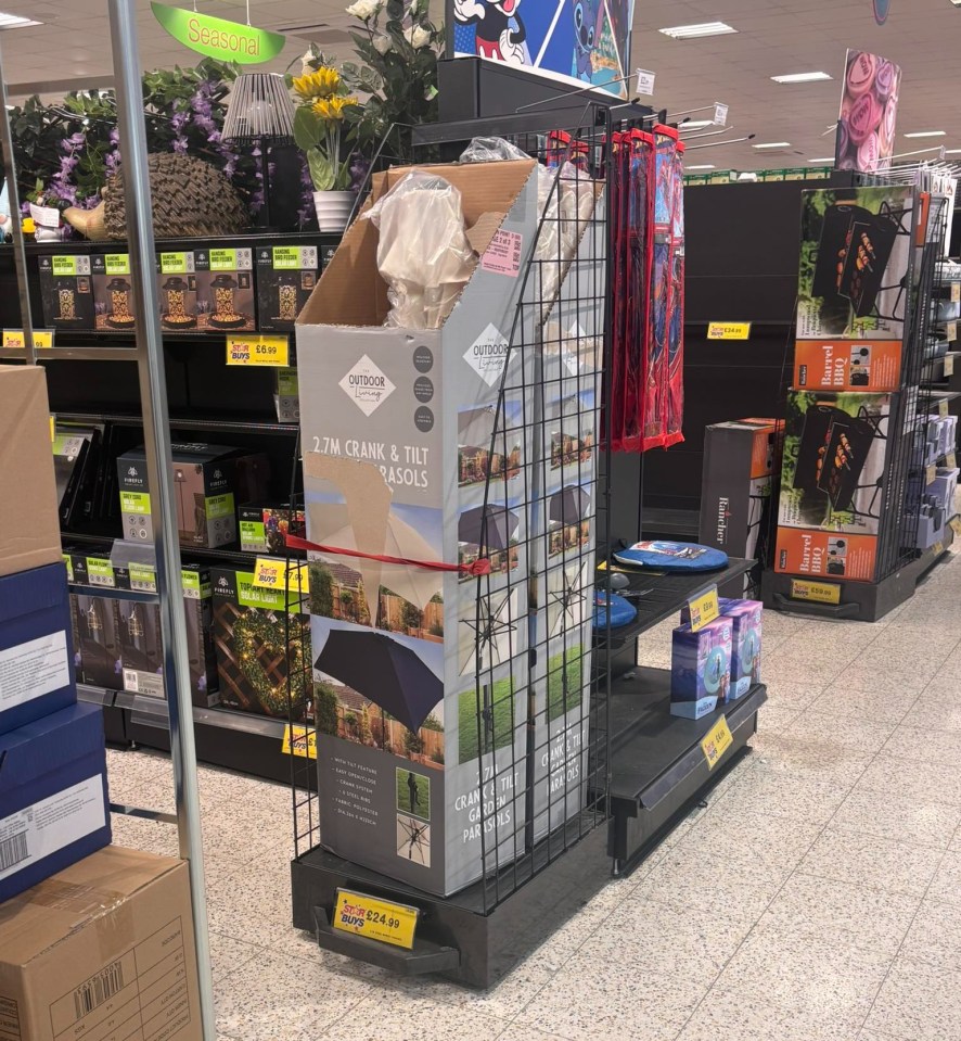 In-store display of patio umbrellas and other outdoor items.