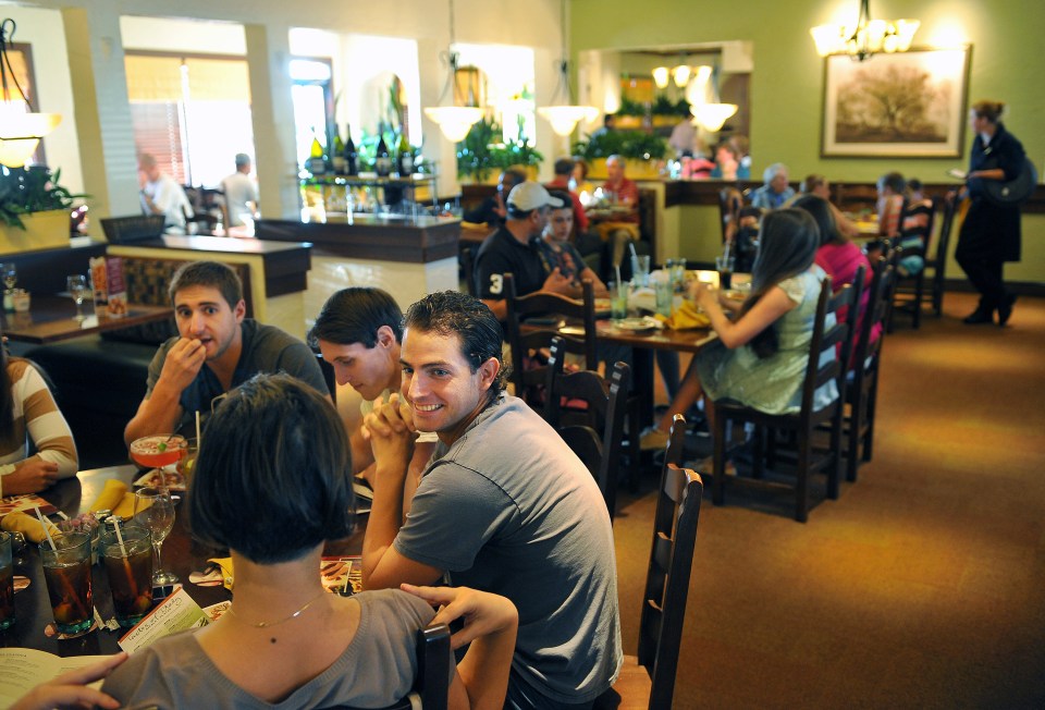 People dining at an Olive Garden restaurant.