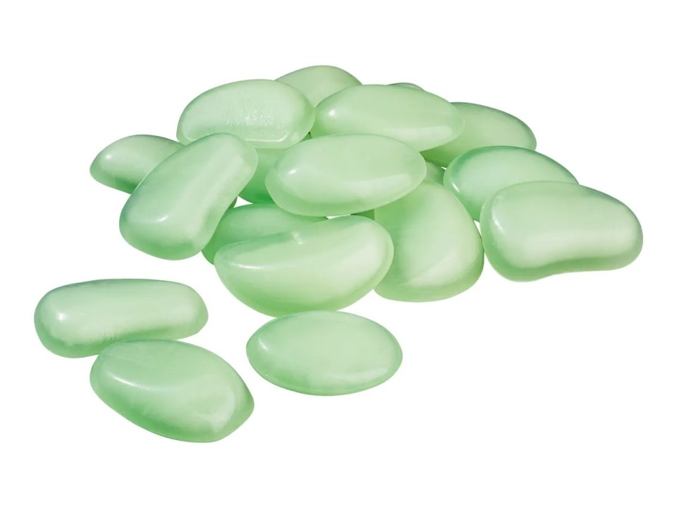 Pile of light green glow-in-the-dark pebbles.