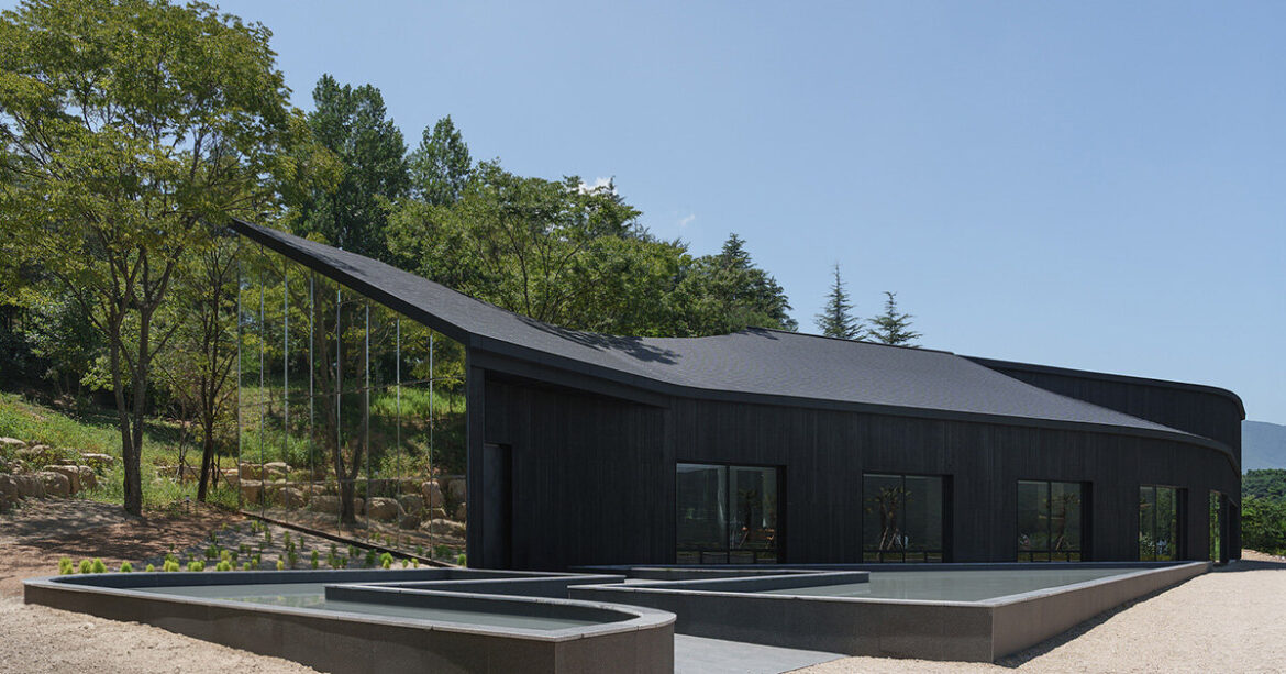 mirrored facades of ‘tan-mok-won’ korean bakery dissolve into healing landscape mirrored facades of 'tan-mok-won' korean bakery dissolve into healing landscape