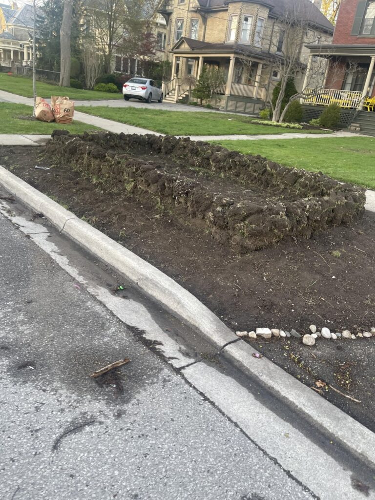 What is this mud(sod?) fort in my neighbors front yard all about?