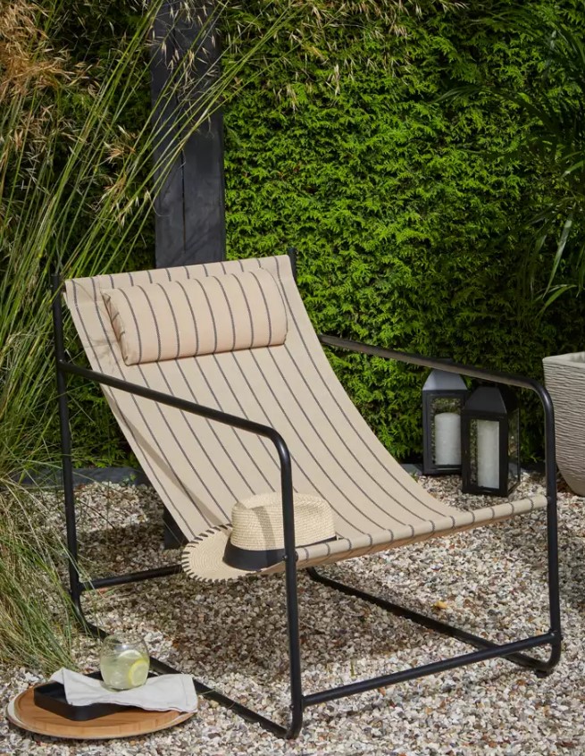 Striped lounge chair outdoors.