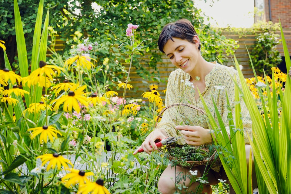 Woman gardening in her backyard.
