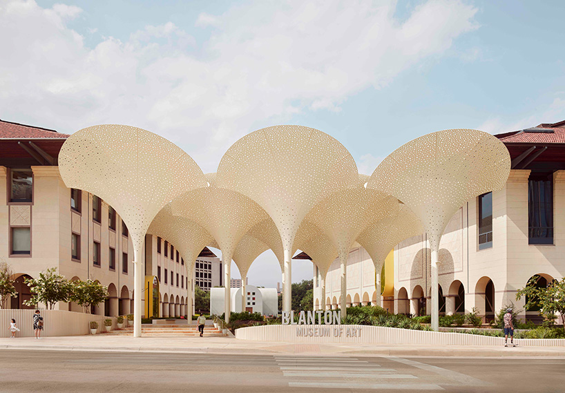 snøhetta's revised landscaping encircles arched petal canopy in austin's blanton museum