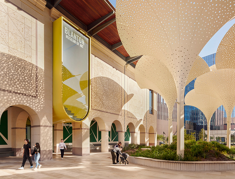 snøhetta's revised landscaping encircles arched petal canopy in austin's blanton museum