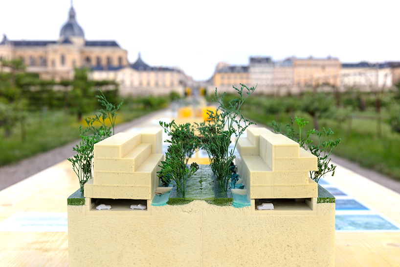 studio 5•5 stretches linear table through versailles' gardens as open dialogue on climate