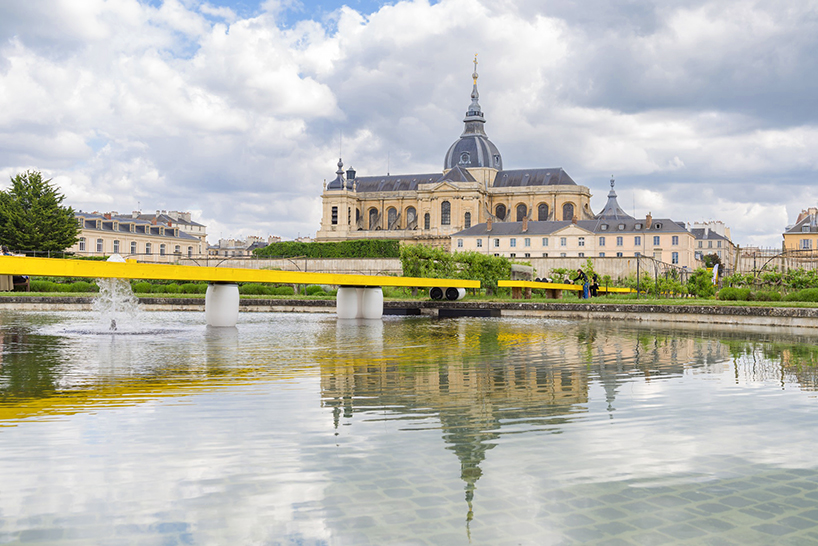 studio 5•5 stretches linear table through versailles' gardens as open dialogue on climate