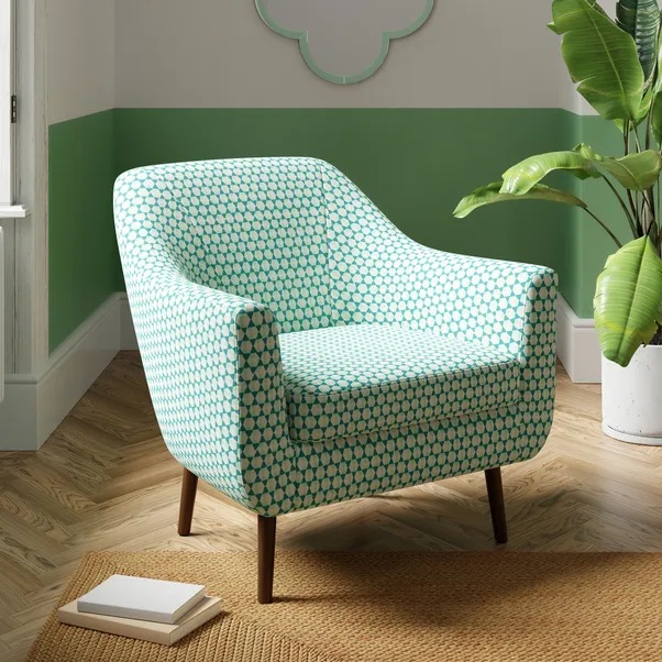 Teal and white patterned armchair.