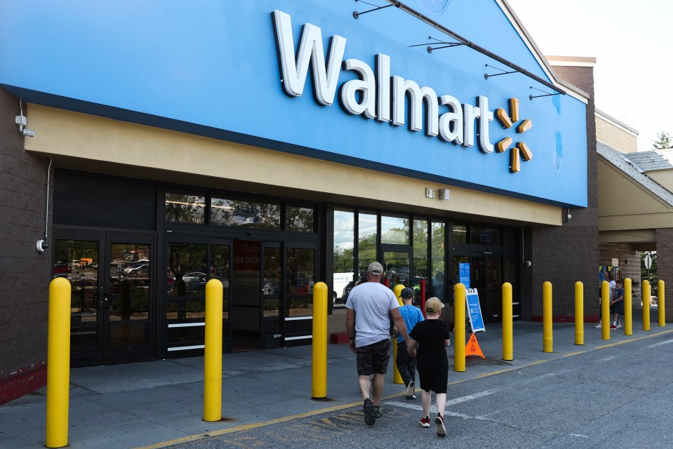 Walmart store entrance with customers entering.