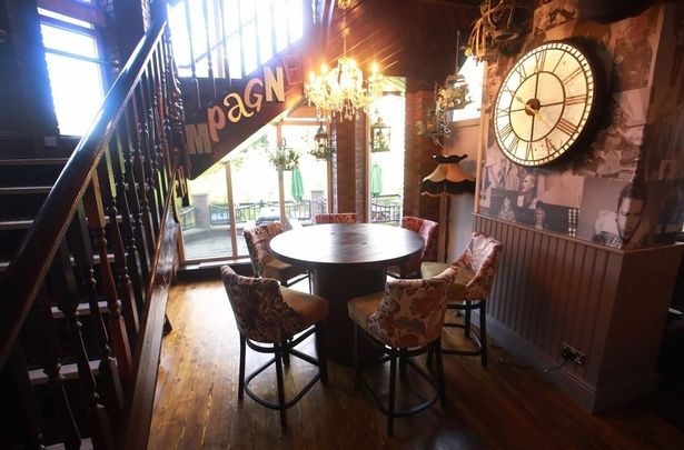 The pub features a clock which includes a designed map of Salford